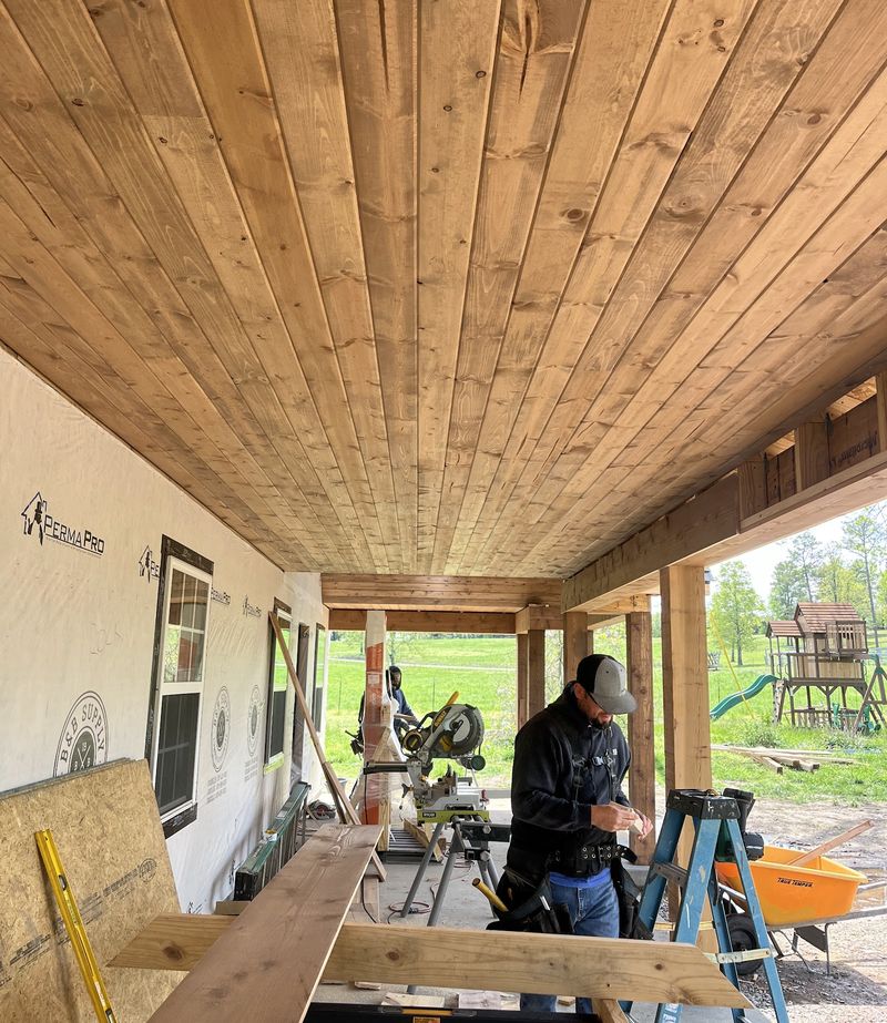 A porch ceiling finished in tongue-and-groove cedar