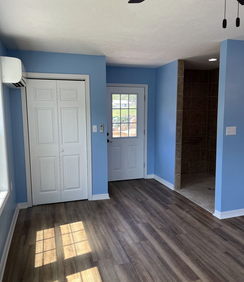 A finished interior with new flooring and trim