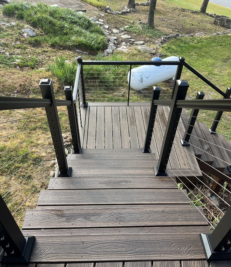 Composite decking and cable rail looking out over a hillside