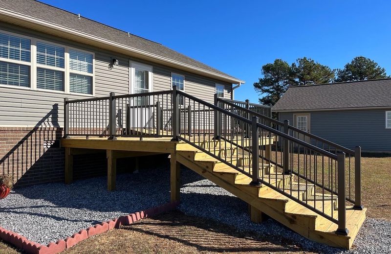 A new deck and stair with black aluminium railing