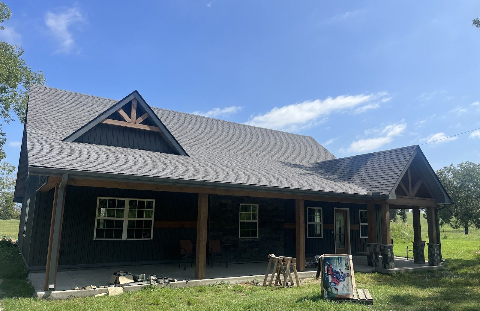 A finished home with a full-width covered porch, built by Circle M Construction near Cave City, Arkansas