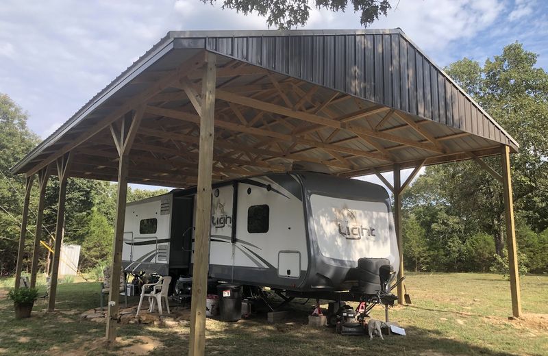 A covered RV port built in post frame
