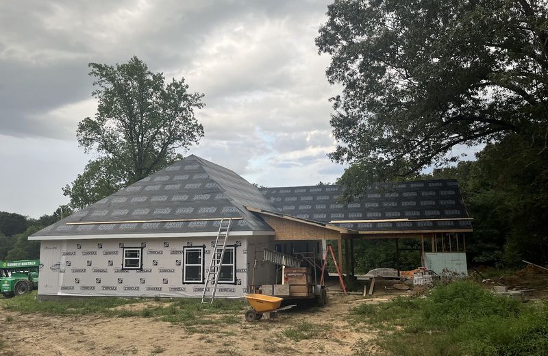 A new house under construction with framing complete